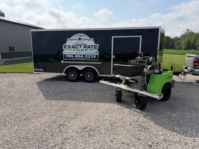 Exact Rate Turf enclosed trailer and Steel Green stand-on sprayer parked at the shop in Boone County, Indiana