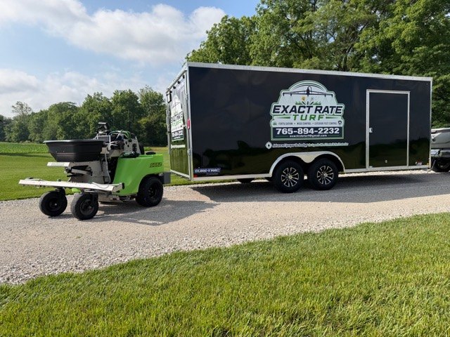 Jay Slipher's Steel Green sprayer and Exact Rate Turf trailer on a customer property in Boone County, Indiana